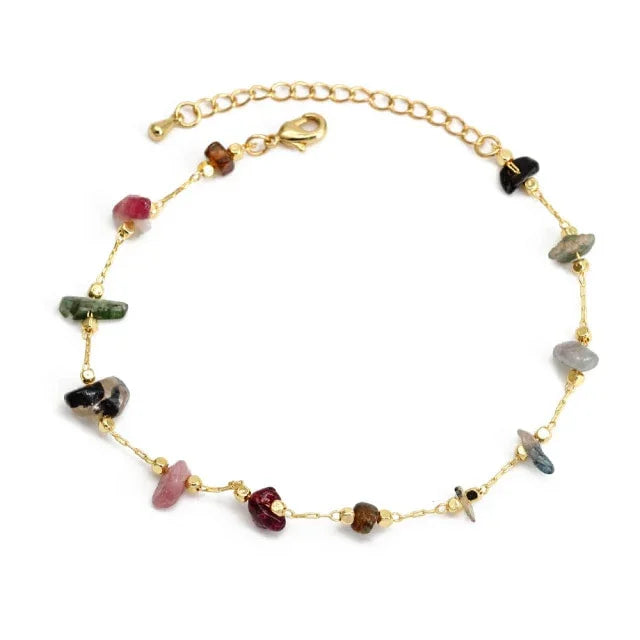 Gold chain bracelet with multicolored gemstone beads, adjustable clasp, on white background.